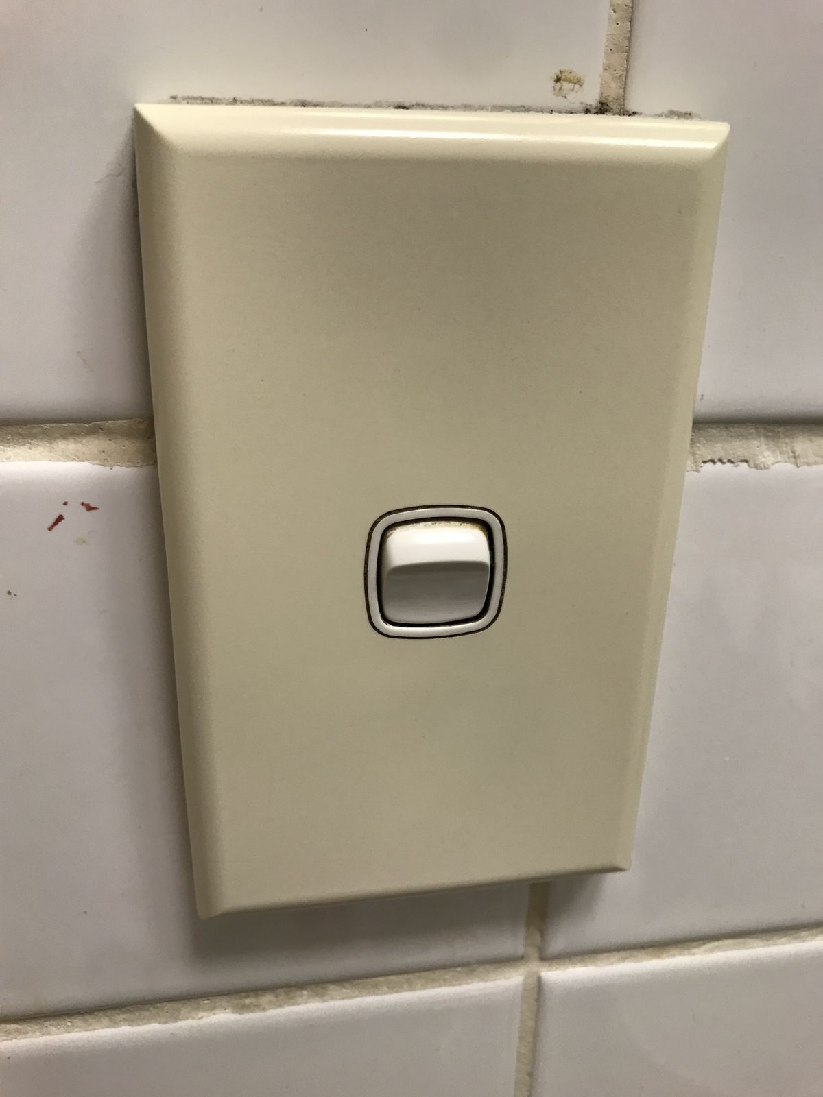 Light switch mounted on an interior wall